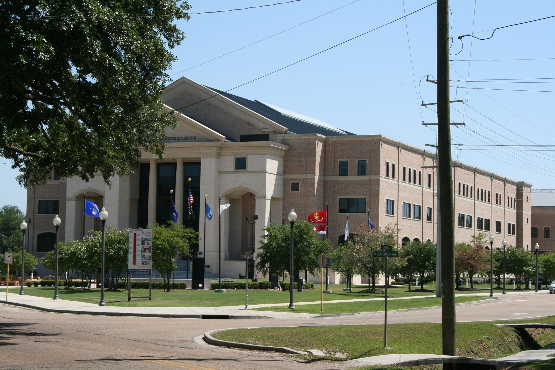 A large building with a red stop sign in front of it
