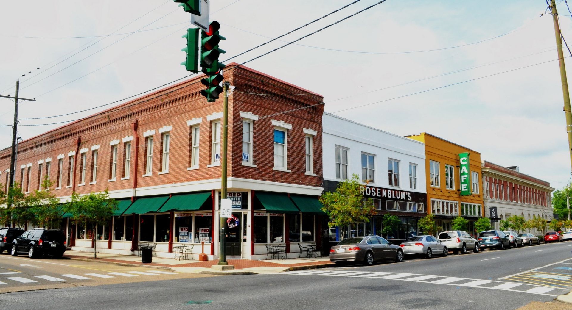 A brick building with a green awning on the side of it