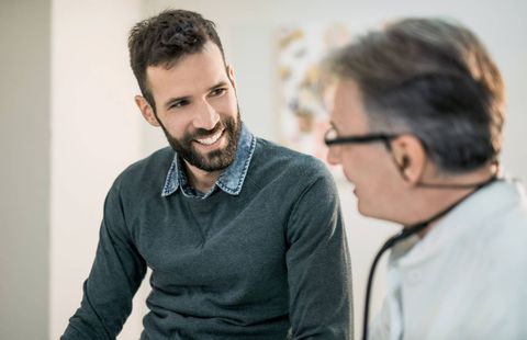 Happy Mid Adult Male Patient Talking With His Doctor — Greensburg, IN — DC Integrated Medicine