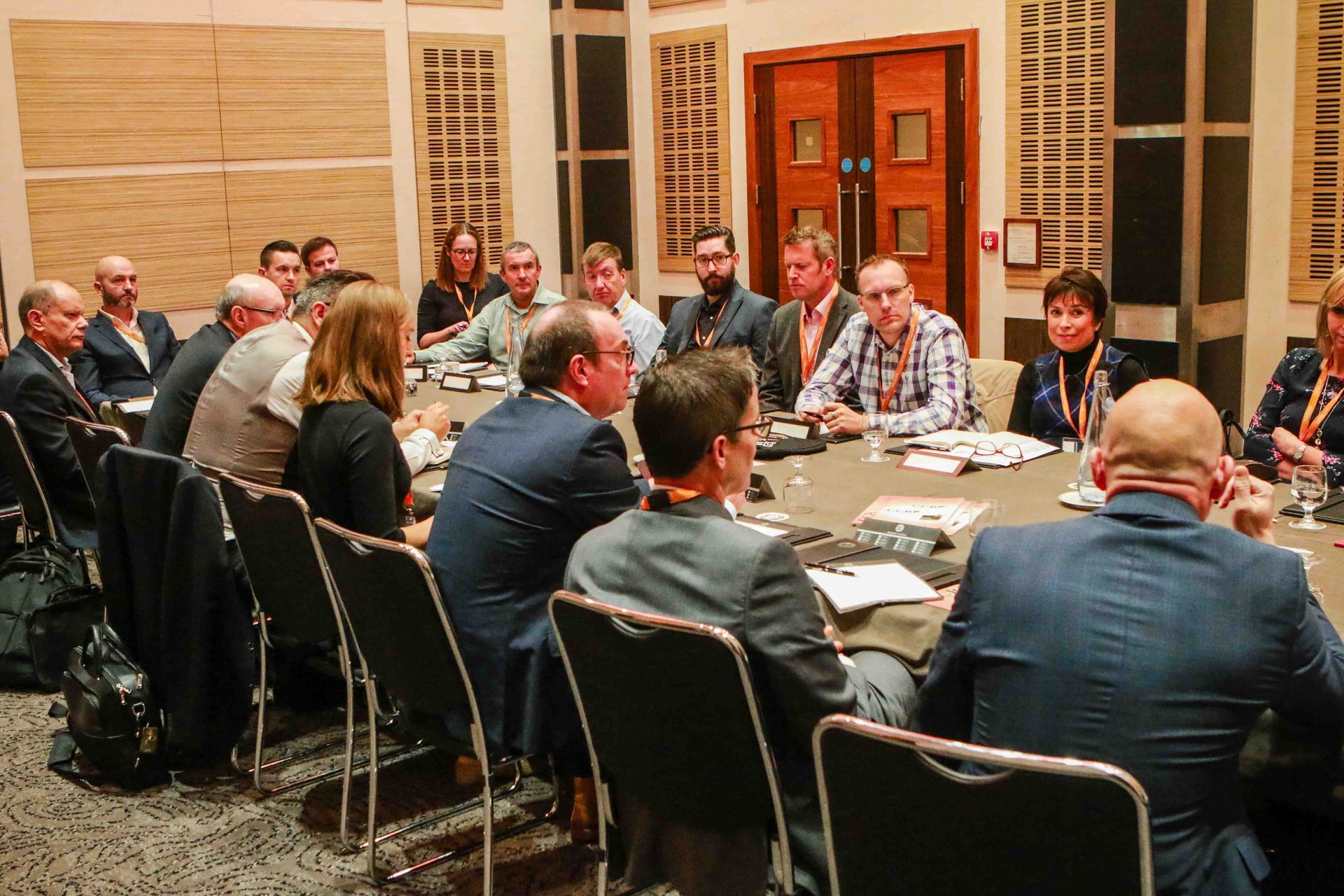 a round table discussion being photographed