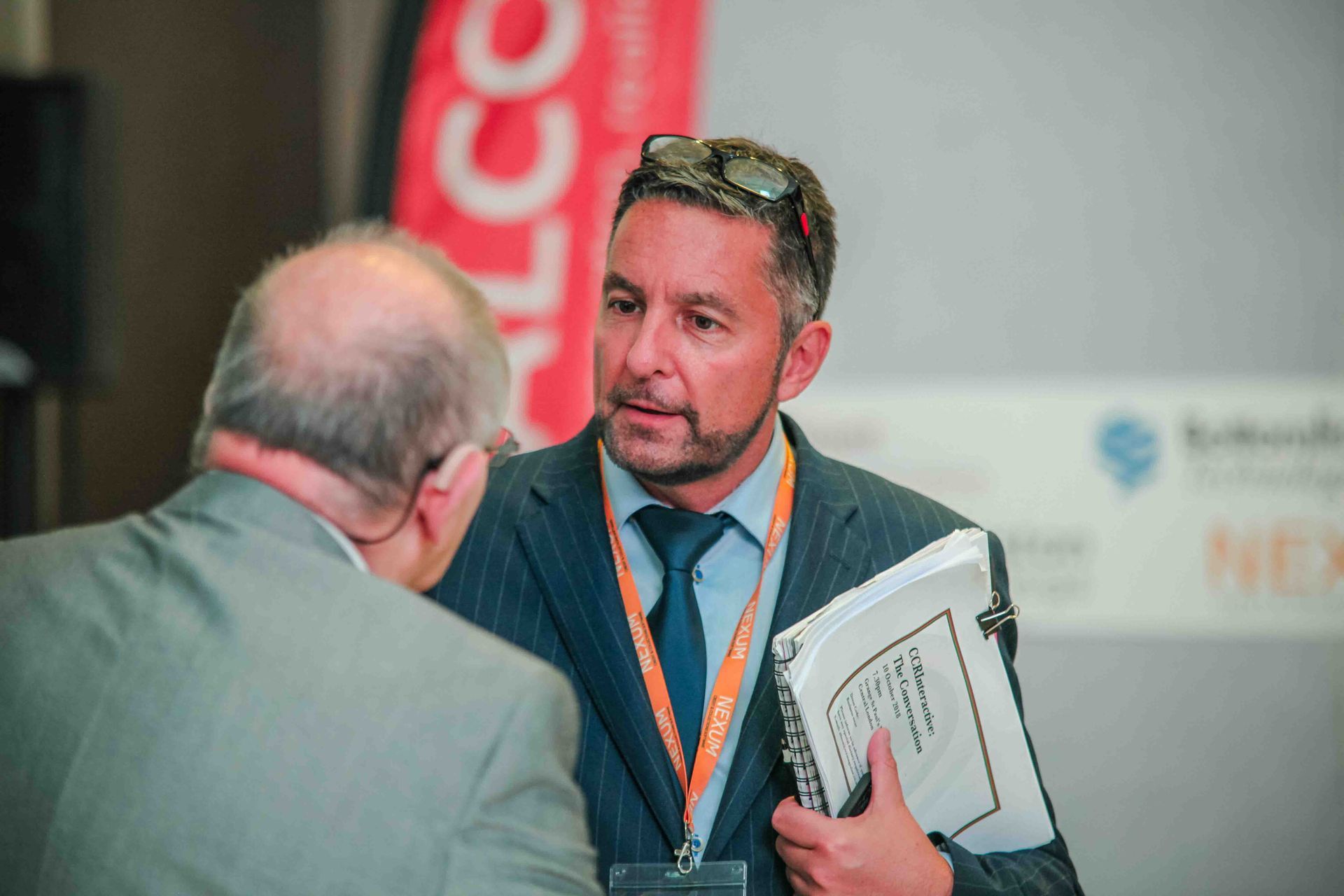 at an exhbirion talking to customers 