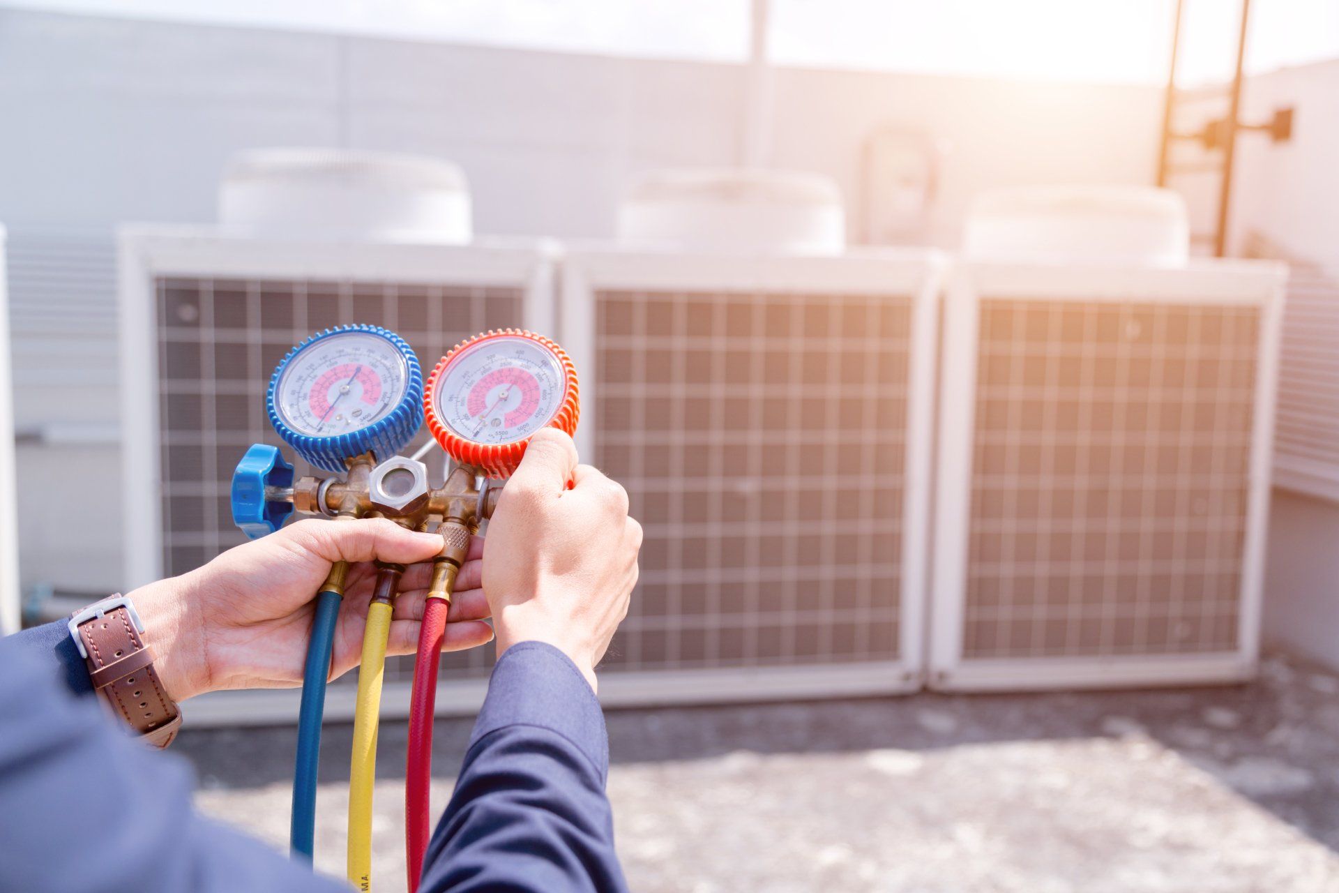 Technician is checking air conditioner ,measuring equipment for filling air conditioners.