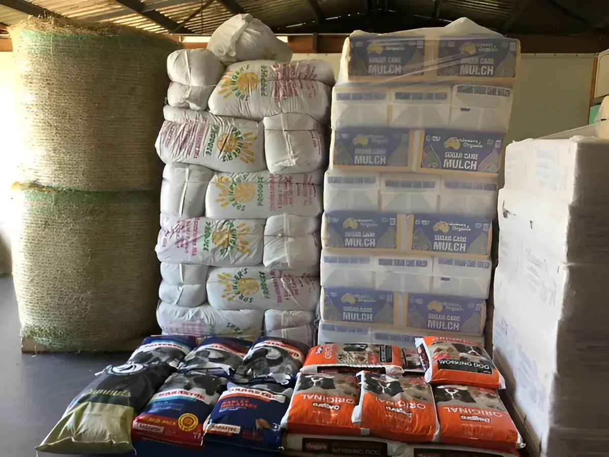 A Warehouse Filled with Lots of Bags of Food and Toilet Paper — Yeppoon Stockfeed & Rural Supplies in Yeppoon, QLD