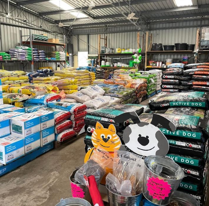 A Warehouse Filled with Lots of Bags of Dog Food — Yeppoon Stockfeed & Rural Supplies in Yeppoon, QLD