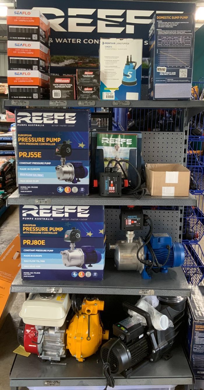 A Shelf Filled with A Variety of Water Pumps in A Store — Yeppoon Stockfeed & Rural Supplies in Yeppoon, QLD