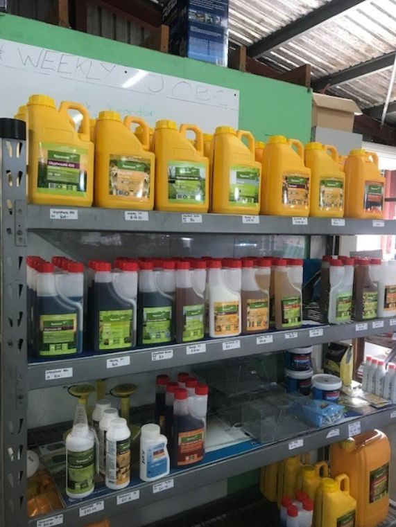 A Store Shelf Filled with Lots of Bottles of Chemicals — Yeppoon Stockfeed & Rural Supplies in Yeppoon, QLD