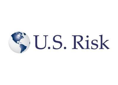 Logo of U.S. Risk, featuring a globe graphic and dark blue text on a white background.