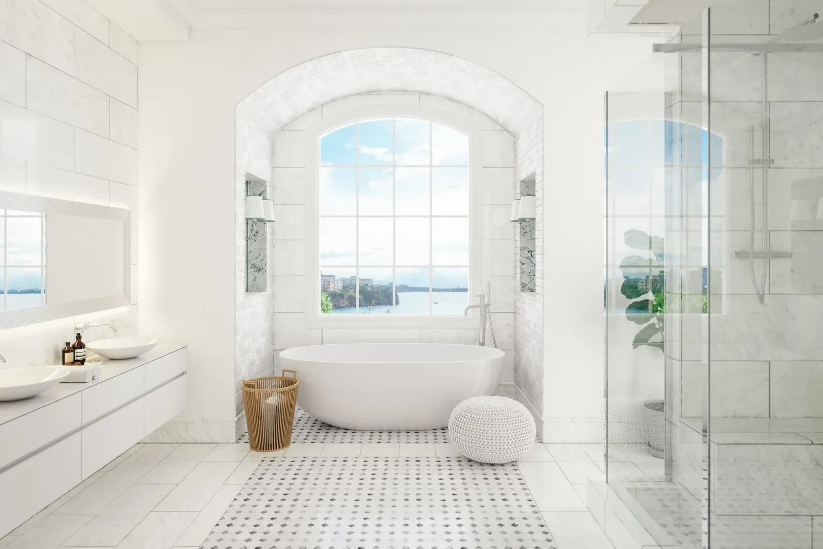 White, bright bathroom with tub in front of large window, glass shower, and vanity with sinks.