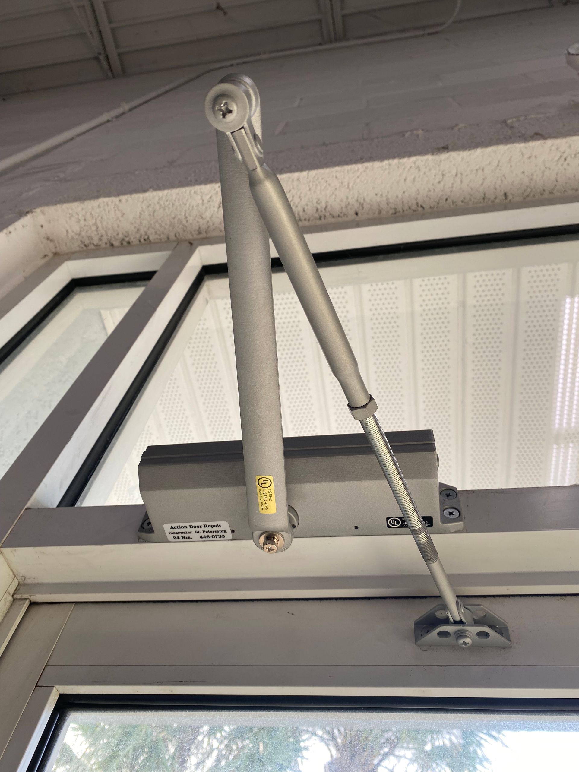 Door closure device for a storefront door in - Lakeland, FL - 