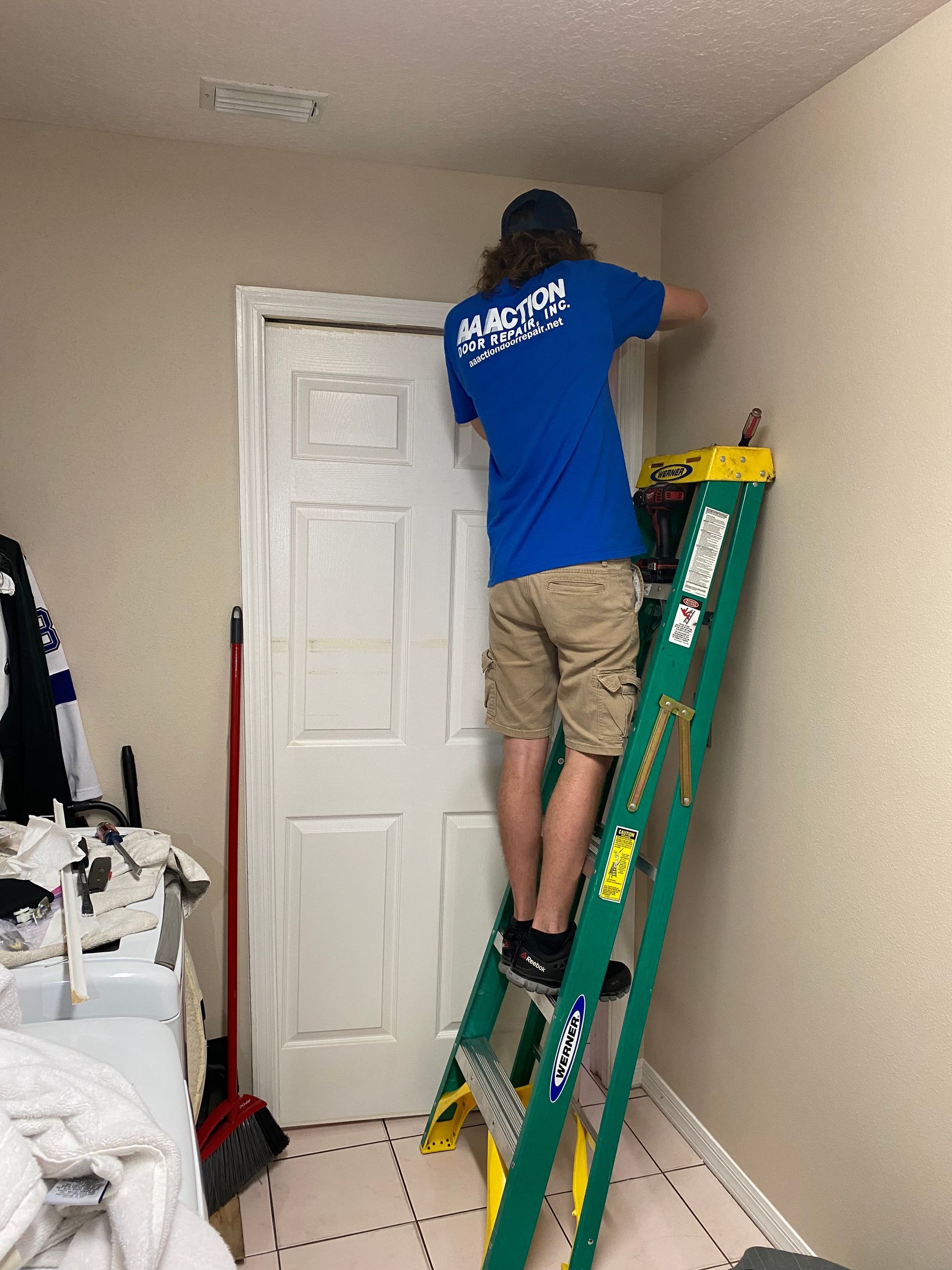 Door repair technician repairing a pocket door - Lakeland, FL - AA Action Door Repair
