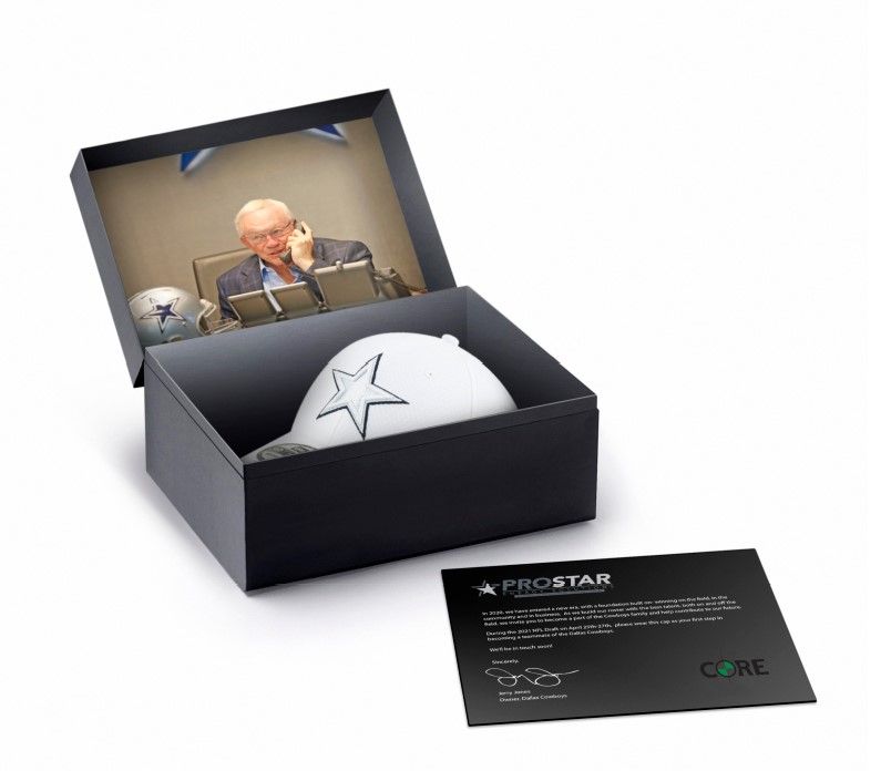 Cowboys hat in a display box with a photo and a card.