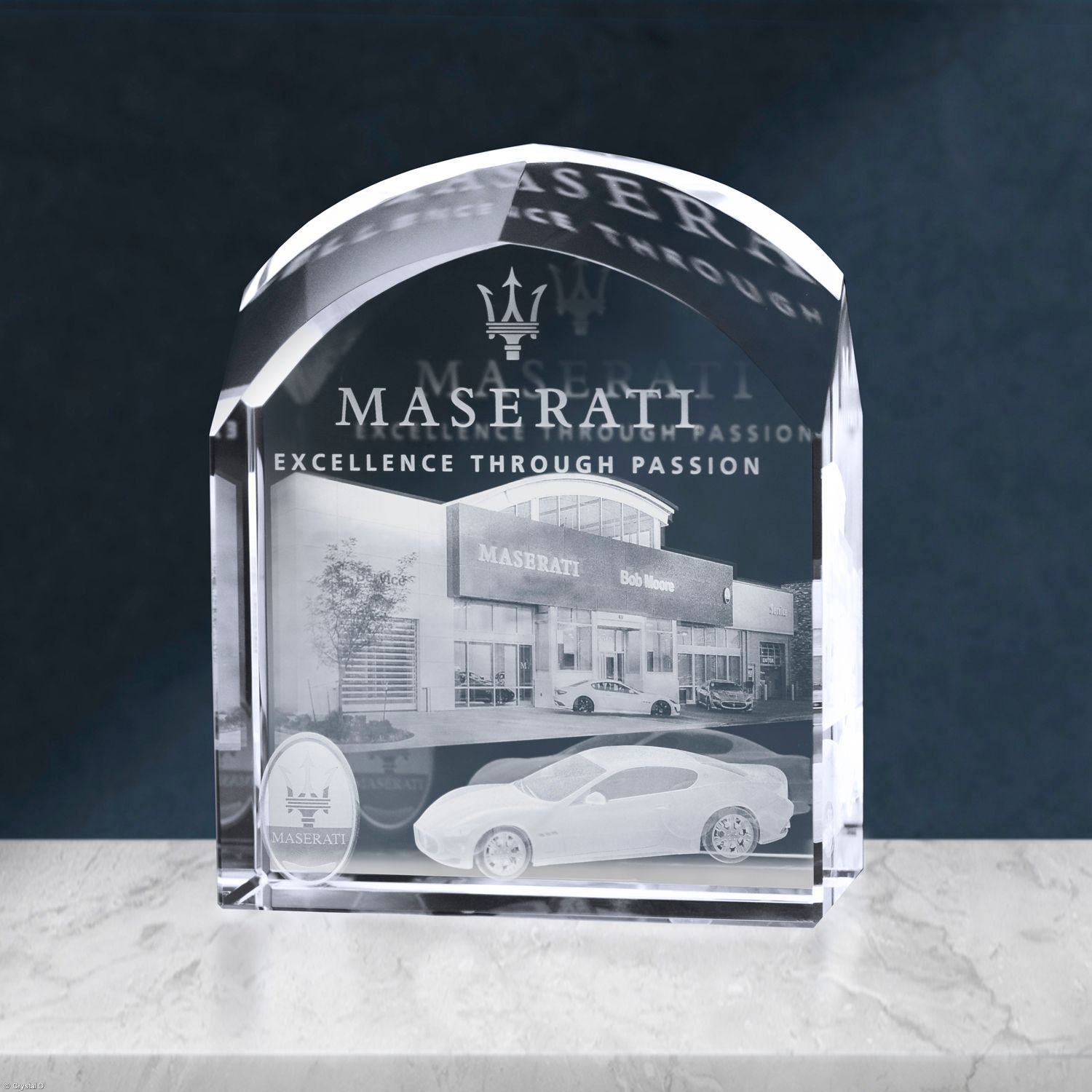 Crystal Maserati award, etched with the logo, car, and dealership building.