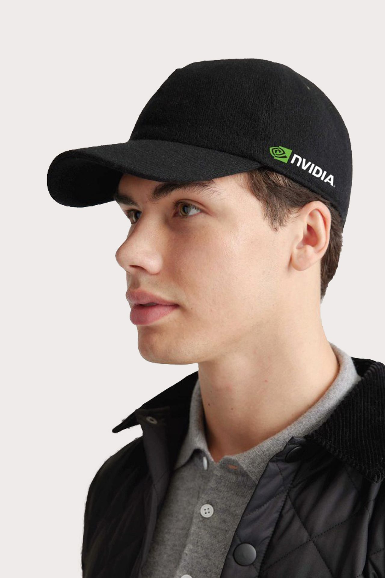 Man wearing a black Nvidia baseball cap, with the company logo on the side.