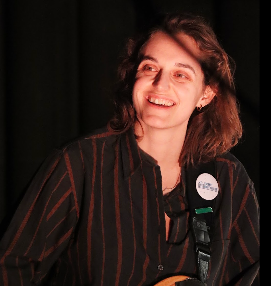 Man with short dark hair and goatee, wearing black shirt, looking at camera.