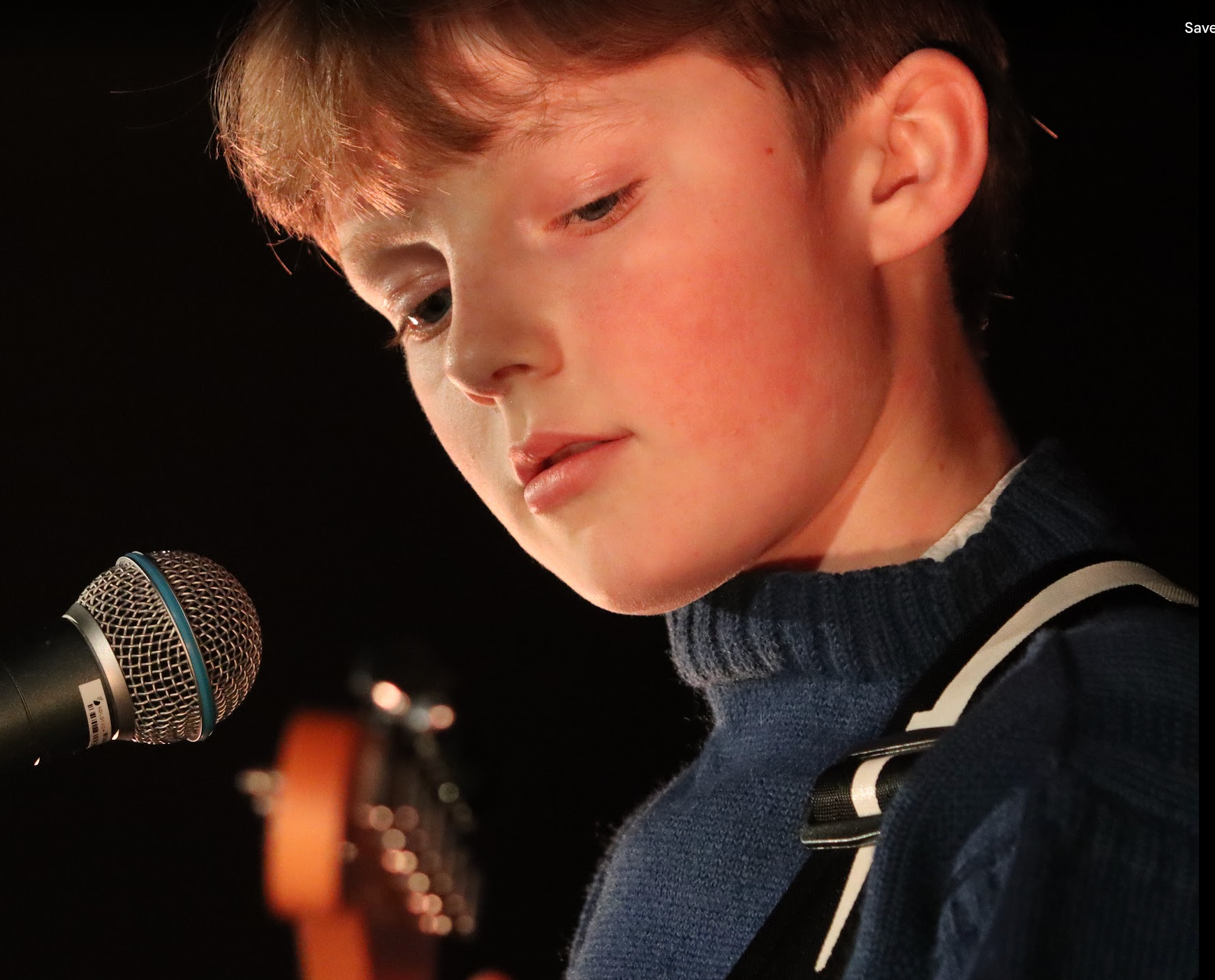 Man with short dark hair and goatee, wearing black shirt, looking at camera.