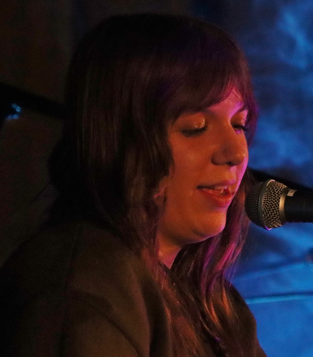 Man with short dark hair and goatee, wearing black shirt, looking at camera.