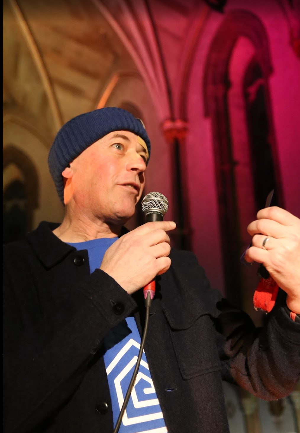 Man with short dark hair and goatee, wearing black shirt, looking at camera.