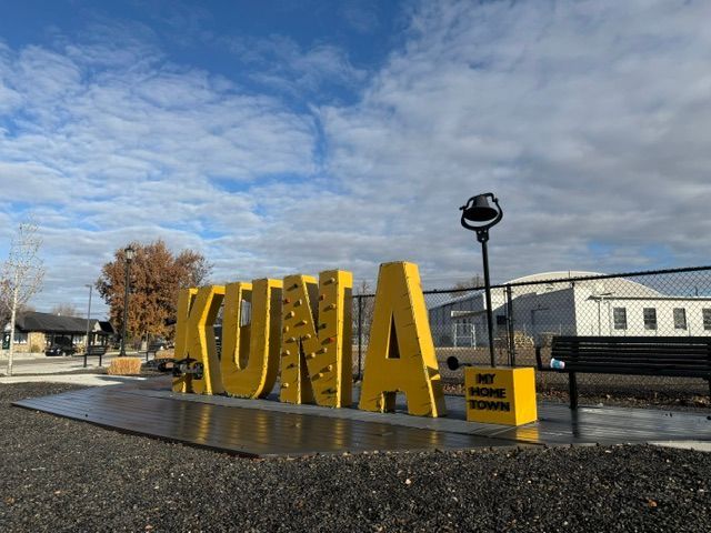 A large yellow sign of letters spelling out Kuna