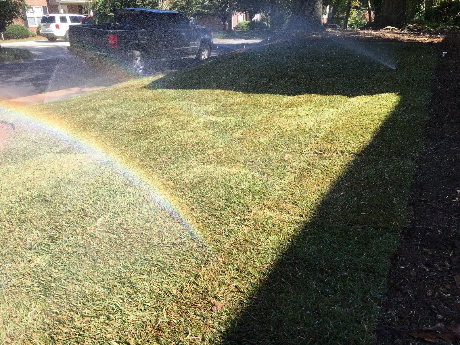 Lawn With Sprinklers — Watkinsville, GA — Four Seasons Lawn Maintenance