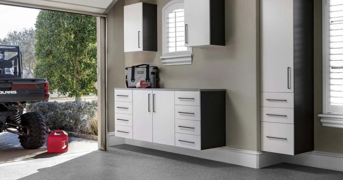 A utility vehicle is parked in a garage next to a window.
