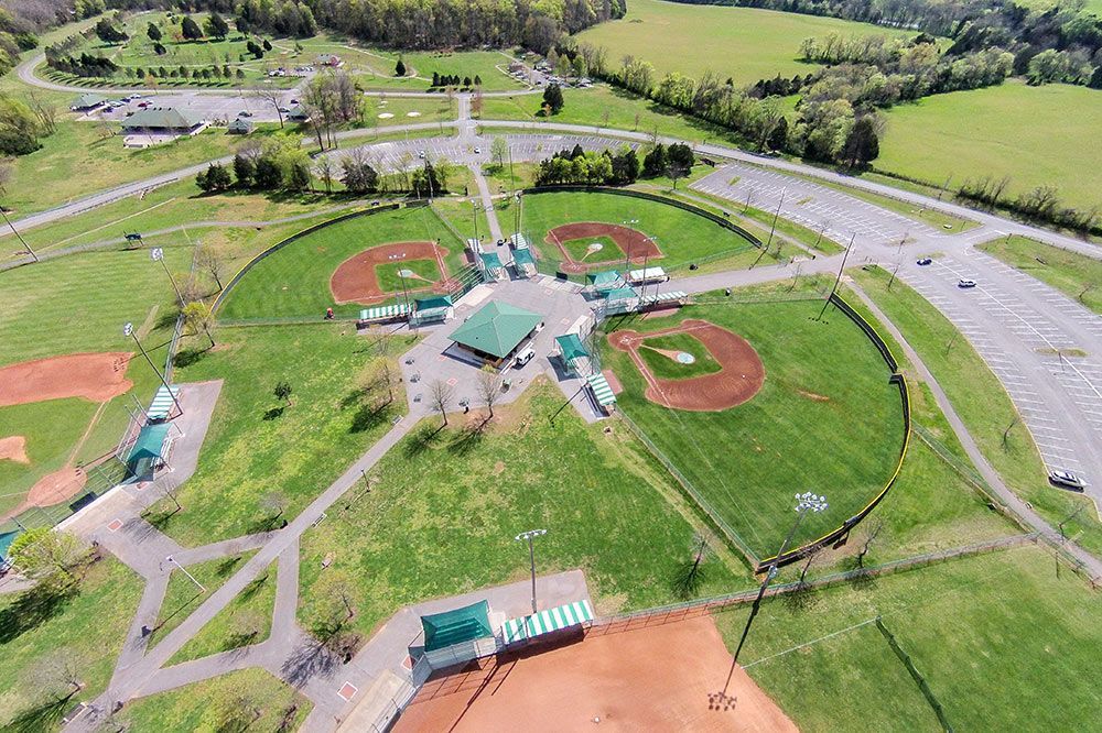 An aerial view of a baseball field in a park.