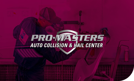 Auto body technician working on a car at Pro Masters Auto Collision & Hail Center.