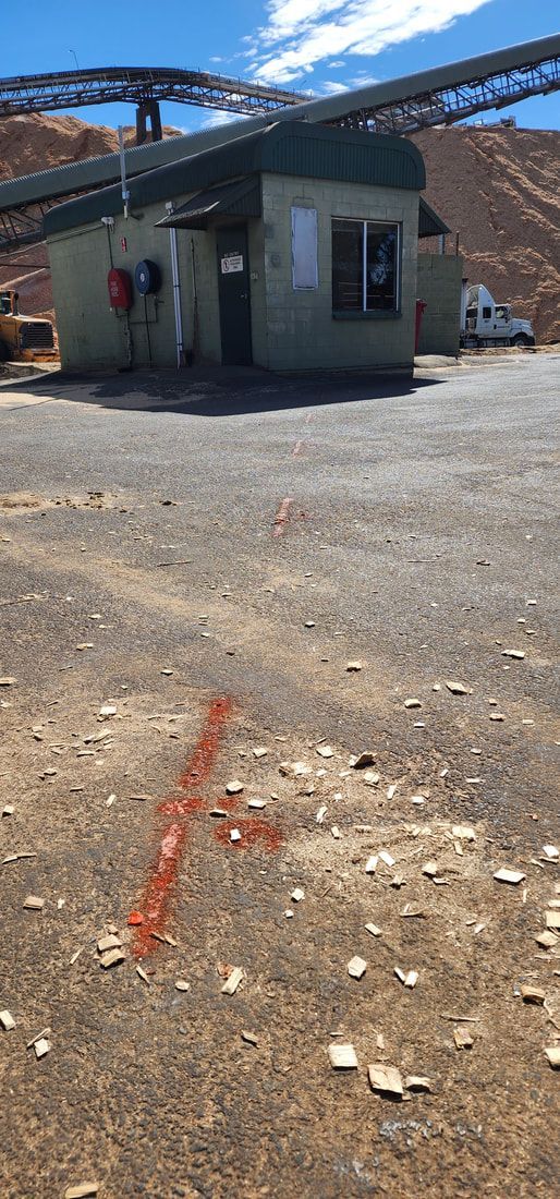A Building, With a Conveyor Belt Above, a Red Arrow Painted — Found It Down Under in Cooroy, QLD