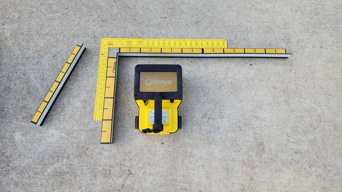 Yellow Construction Tools, Rulers, and a Handheld Detector, on a Concrete Surface — Found It Down Under in Gympie, QLD