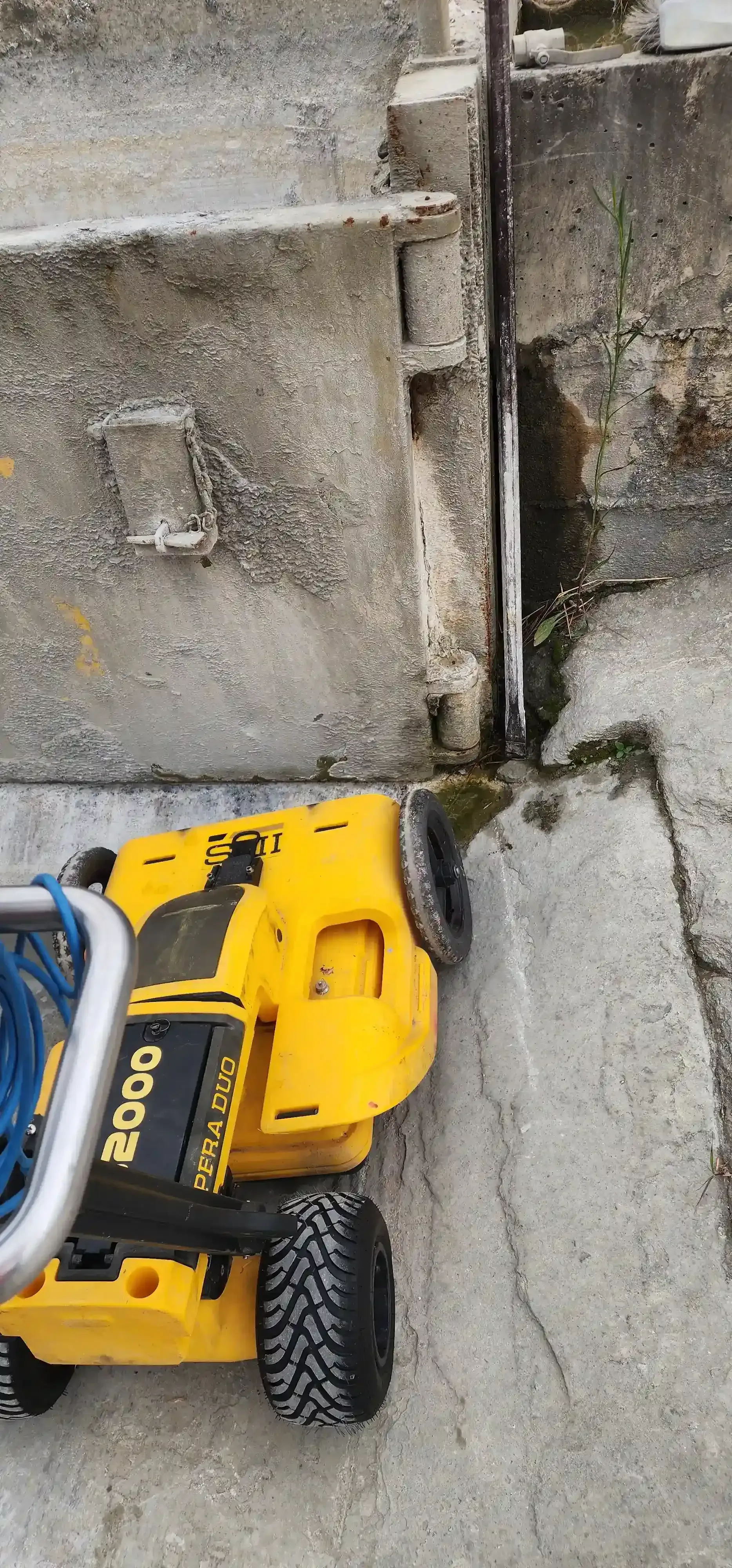 A yellow power washer cleaning steps. The steps are concrete with a metal railing. — Found It Down Under in Gympie, QLD