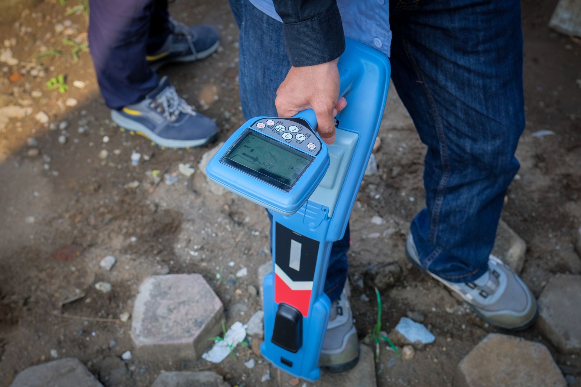 Person Holding a Blue Utility Locator, Walking on a Paved Surface — Found It Down Under in Gympie, QLD