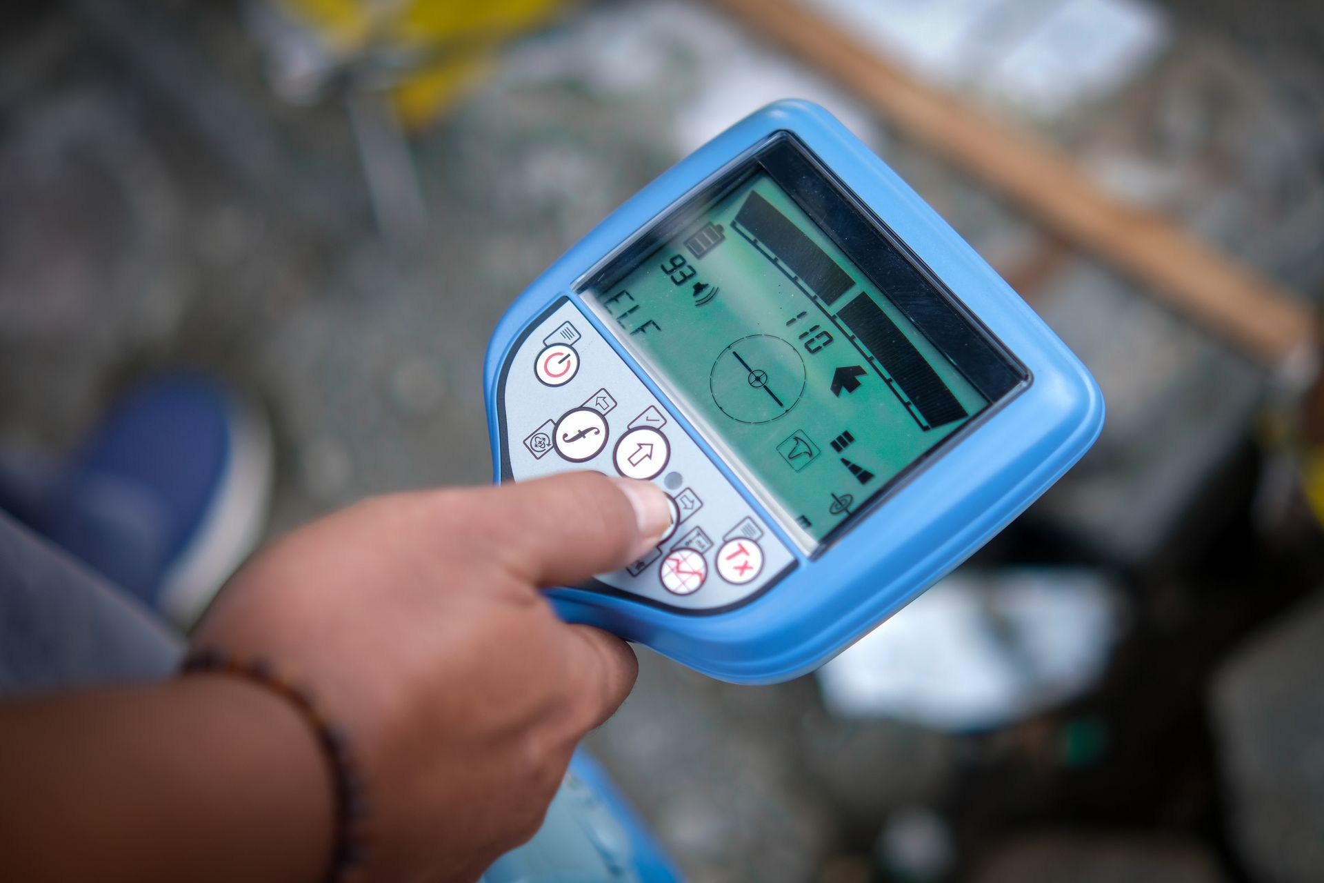 Person Holding a Blue Electronic Device, Likely a Detector, Outdoors — Found It Down Under in Gympie, QLD