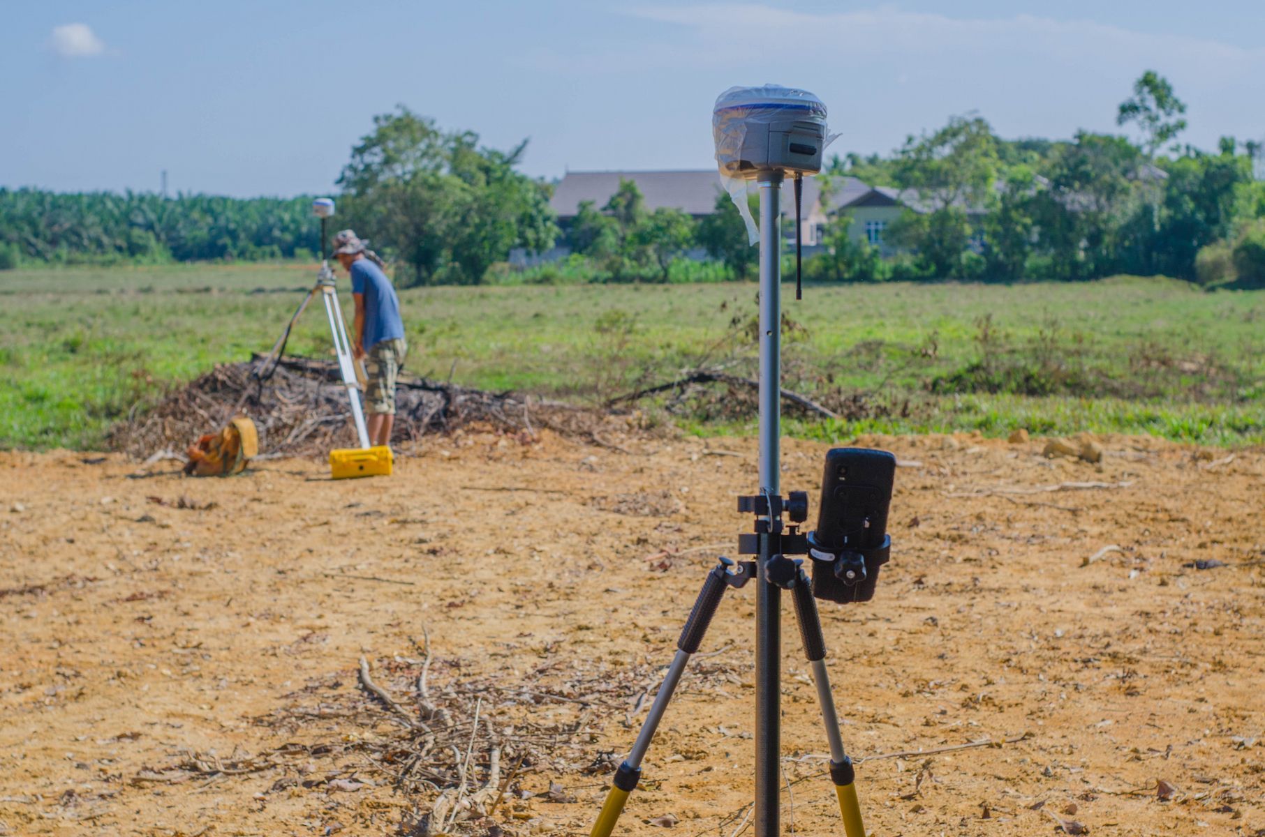 Surveyor Uses Equipment in a Field — Found It Down Under in Hervey Bay, QLD