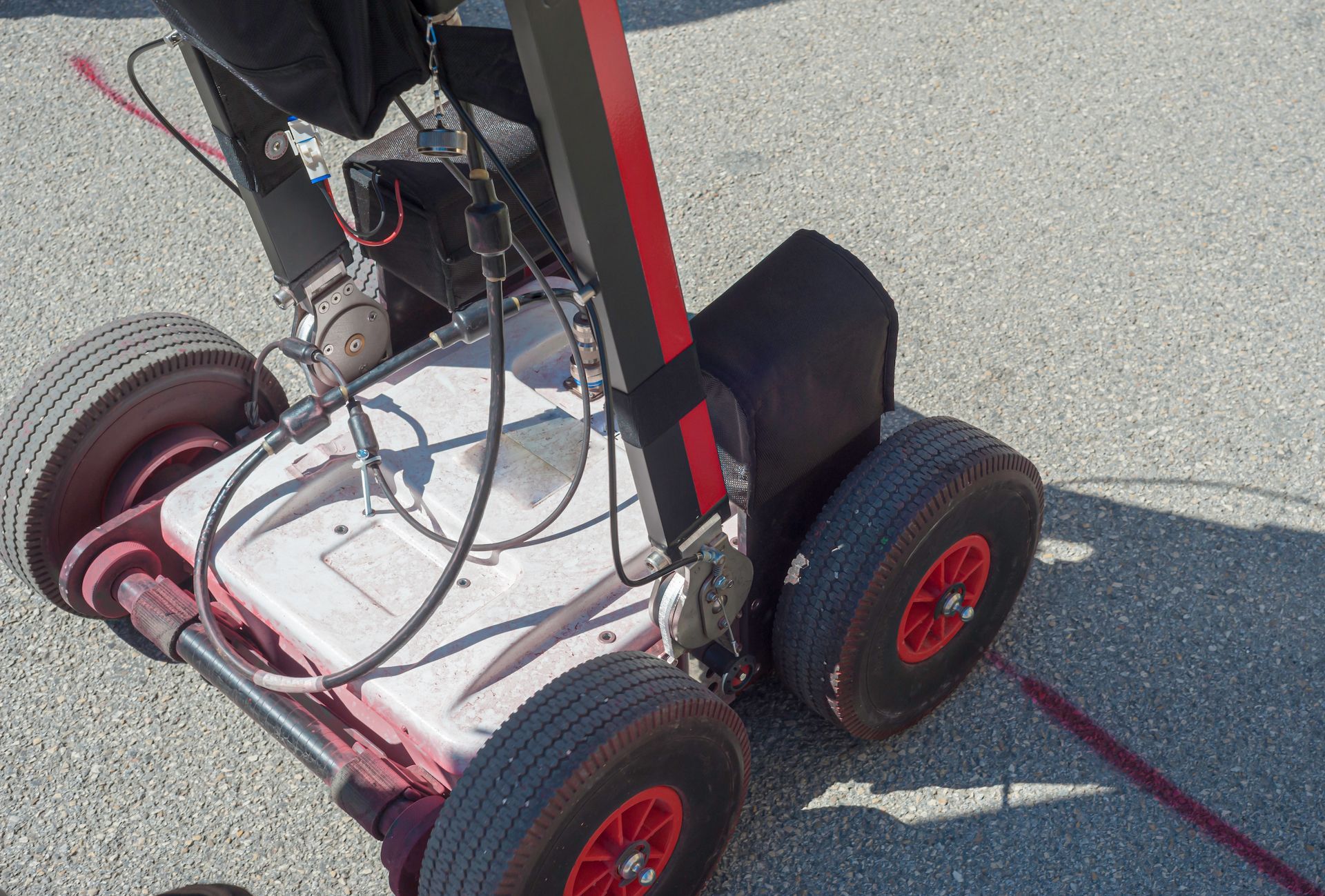 Red-wheeled, Wheeled Device on Pavement — Found It Down Under in Hervey Bay, QLD
