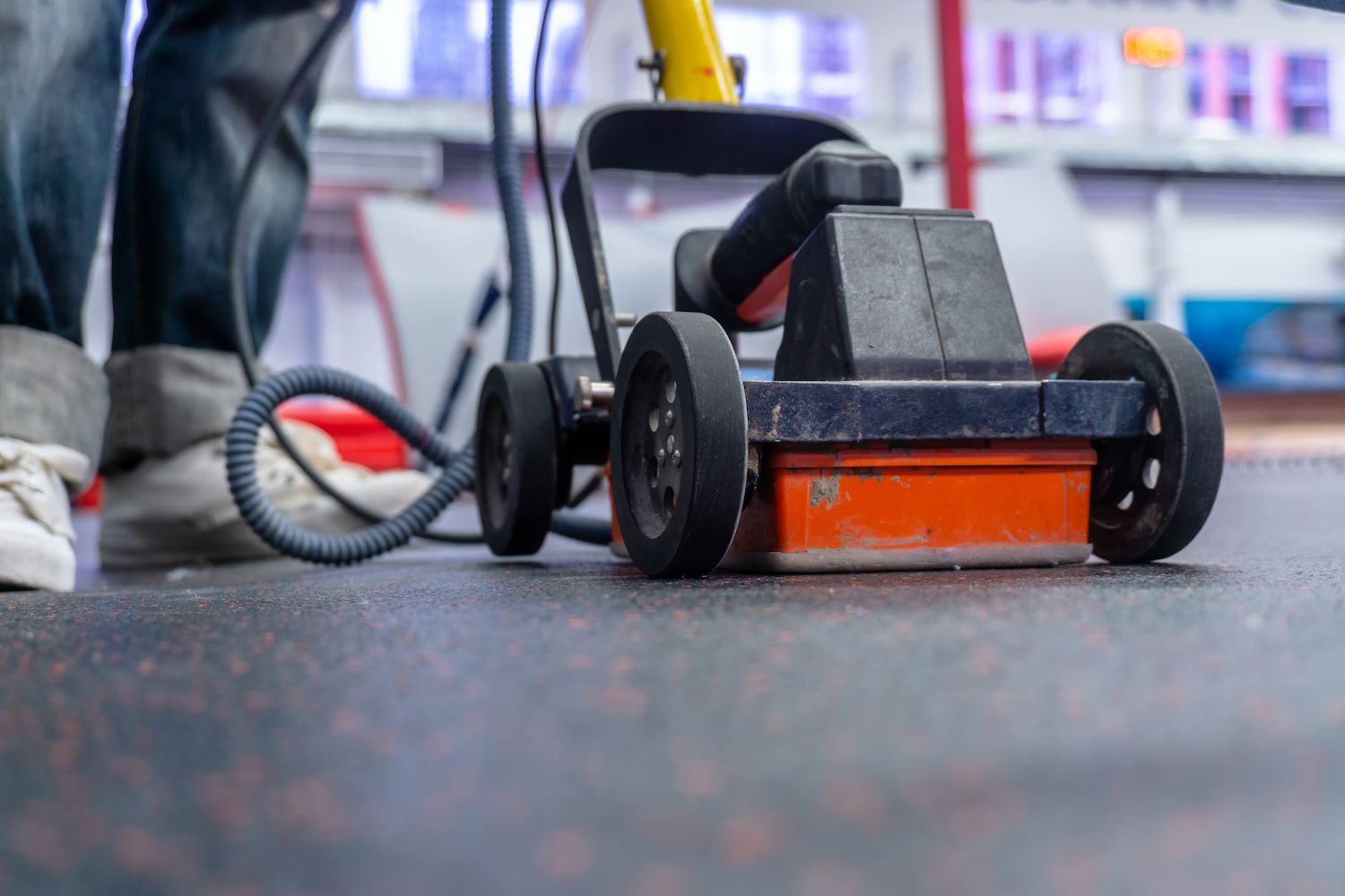 Person Using a Floor Buffer on a Speckled Floor, Close-up View — Found It Down Under in Kilkivan, QLD