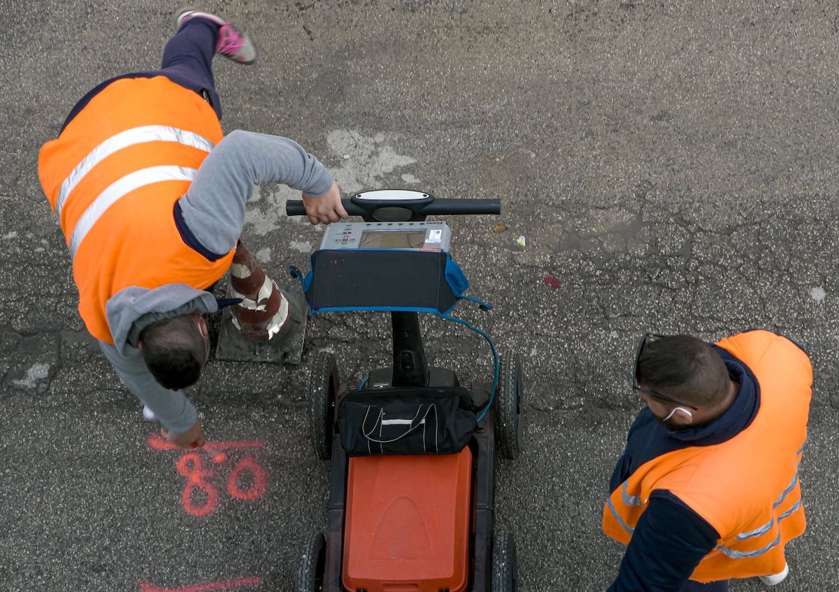 Two People in Orange Vests Use Ground-penetrating Radar on Asphalt — Found It Down Under in Gympie, QLD