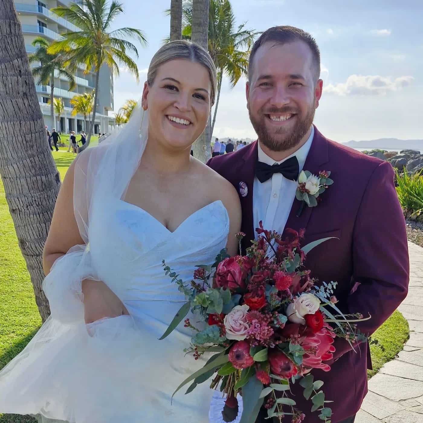 A Bride And Groom Are Posing For A Picture — Lynda Ross Marriage Celebrant In Townsville, QLD
