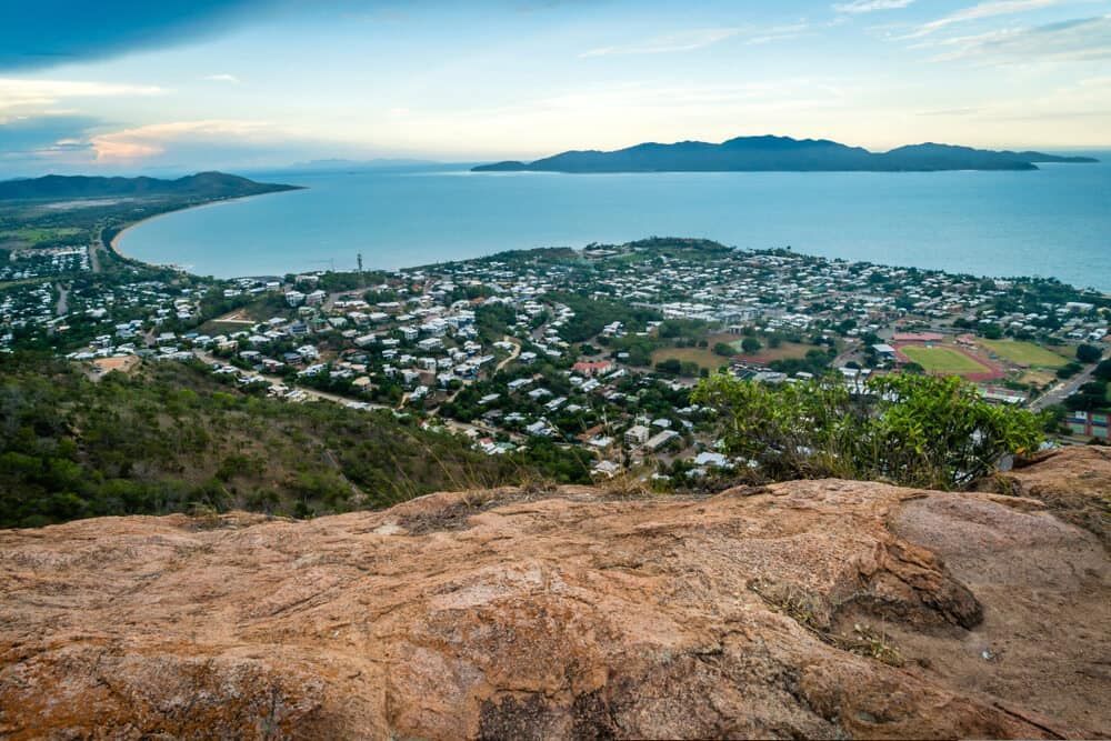 A View Of A City From A Rocky Cliff Overlooking The Ocean — Lynda Ross Marriage Celebrant In Townsville, QLD