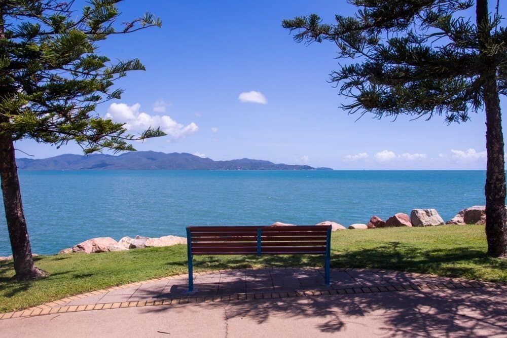 A Wooden Bench With A View Of The Ocean — Lynda Ross Marriage Celebrant In Magnetic Island, QLD