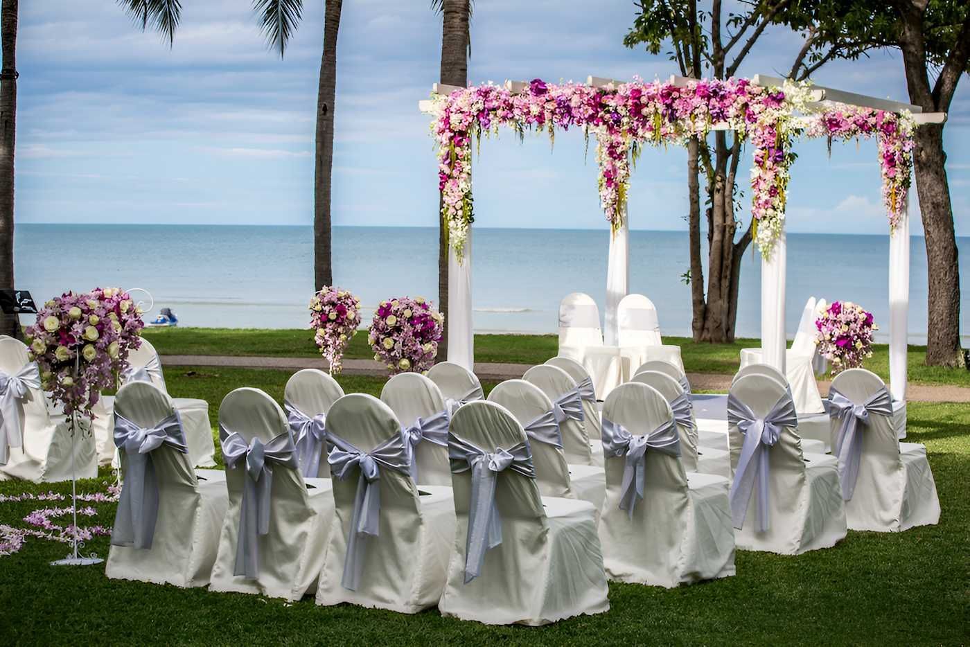 A Wedding Arch Decorated With Flowers — Lynda Ross Marriage Celebrant In Magnetic Island, QLD