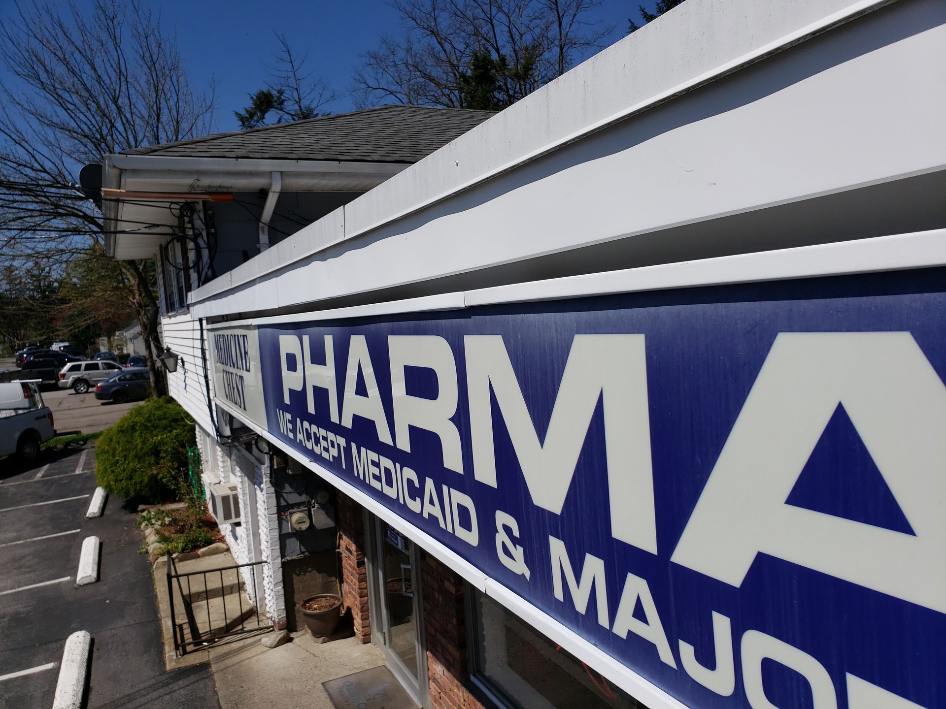 A blue and white sign that says pharma on it