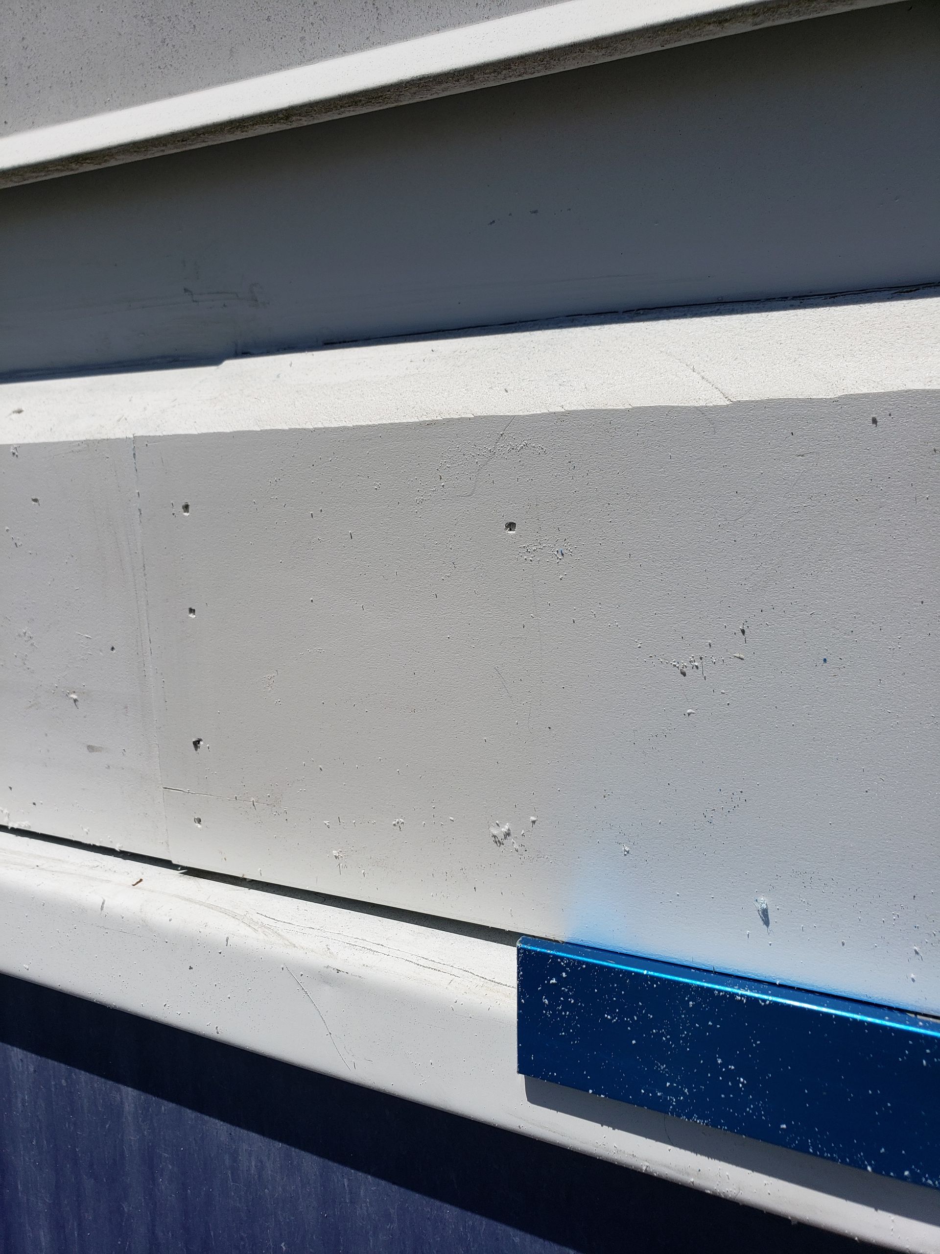 A close up of a blue and white striped wall