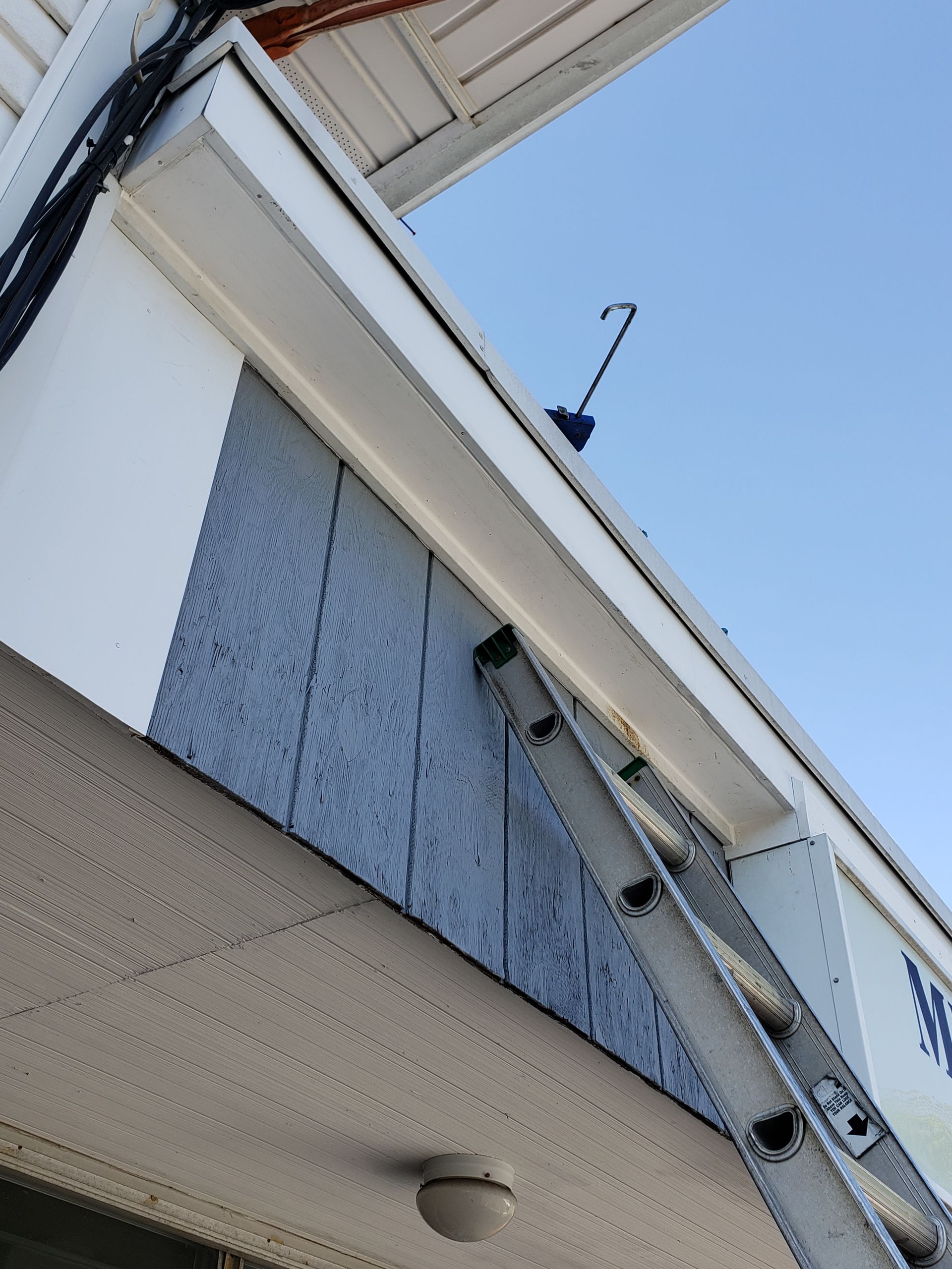 A ladder is attached to the side of a building