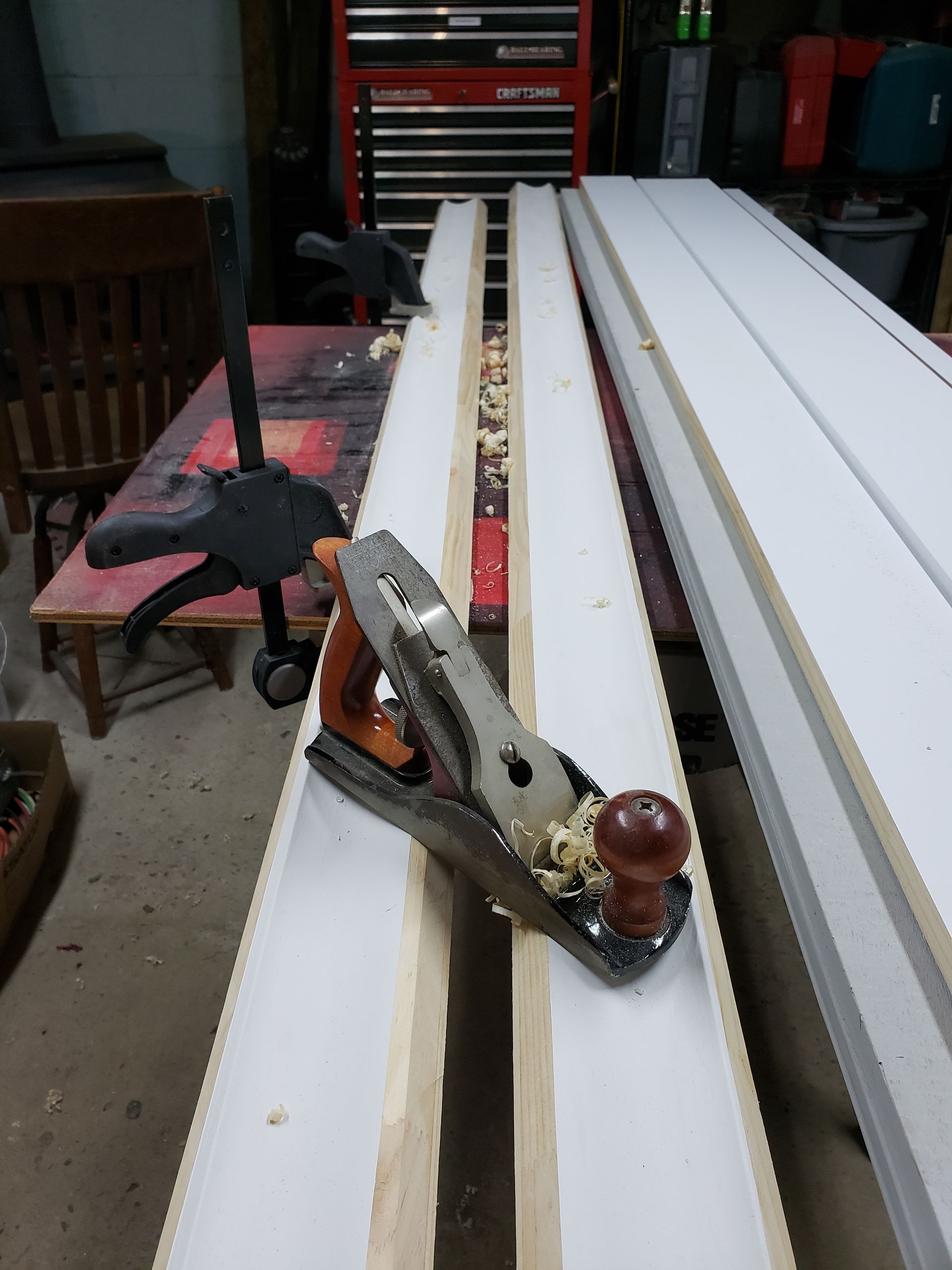 A plane is sitting on top of a piece of wood.