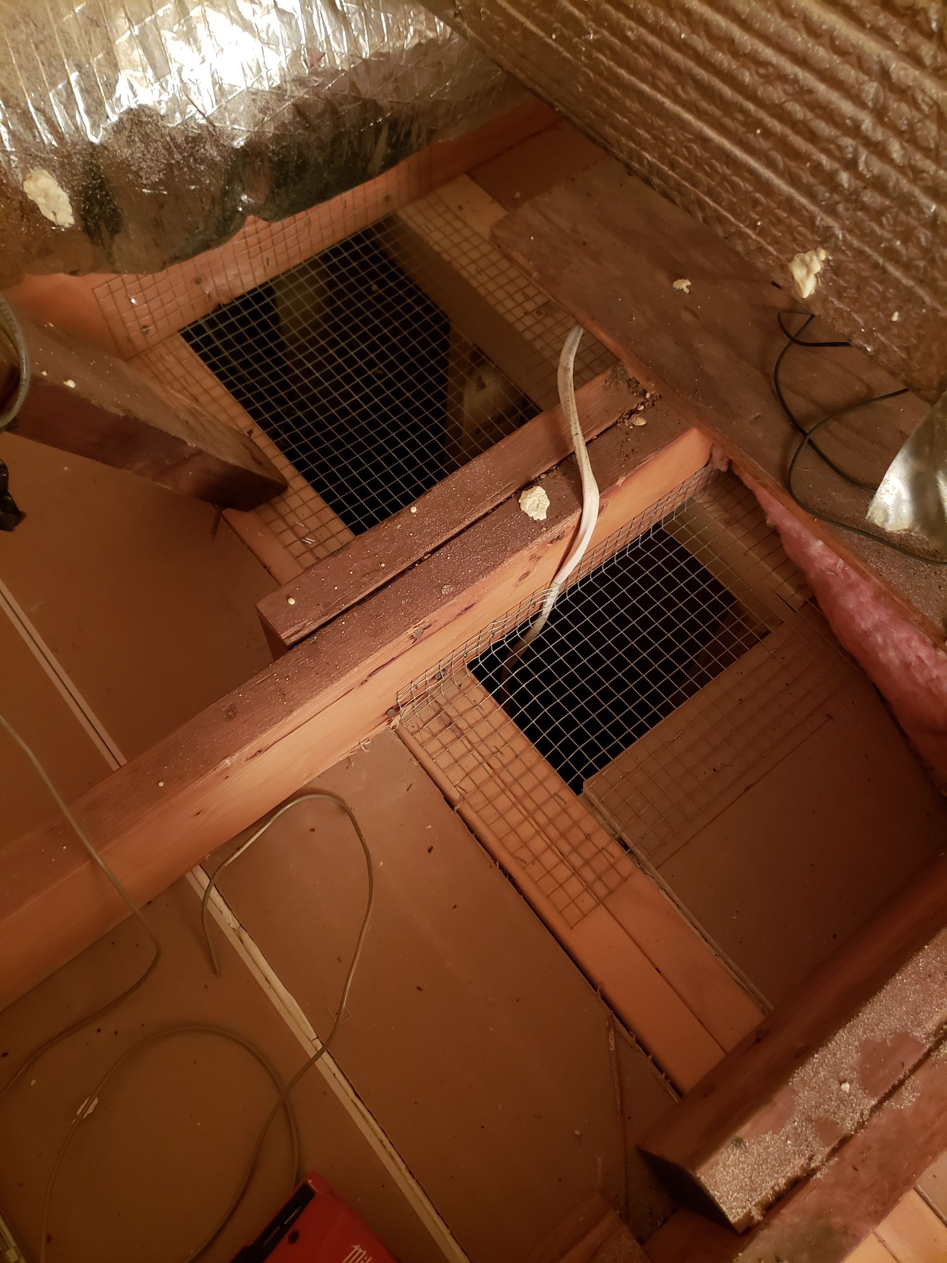 A room with a lot of wood and a lot of wires