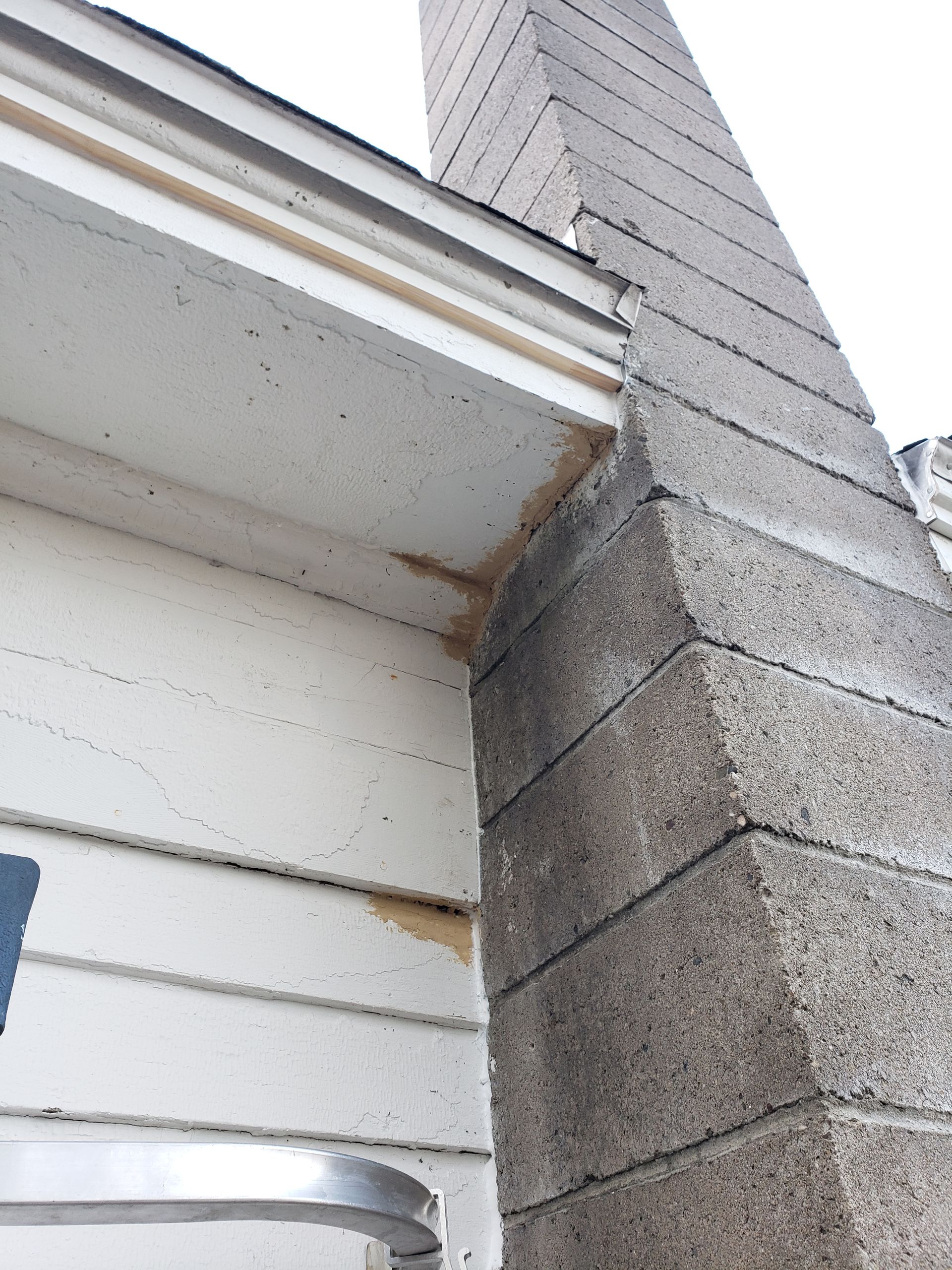 A house with a chimney on the side of it