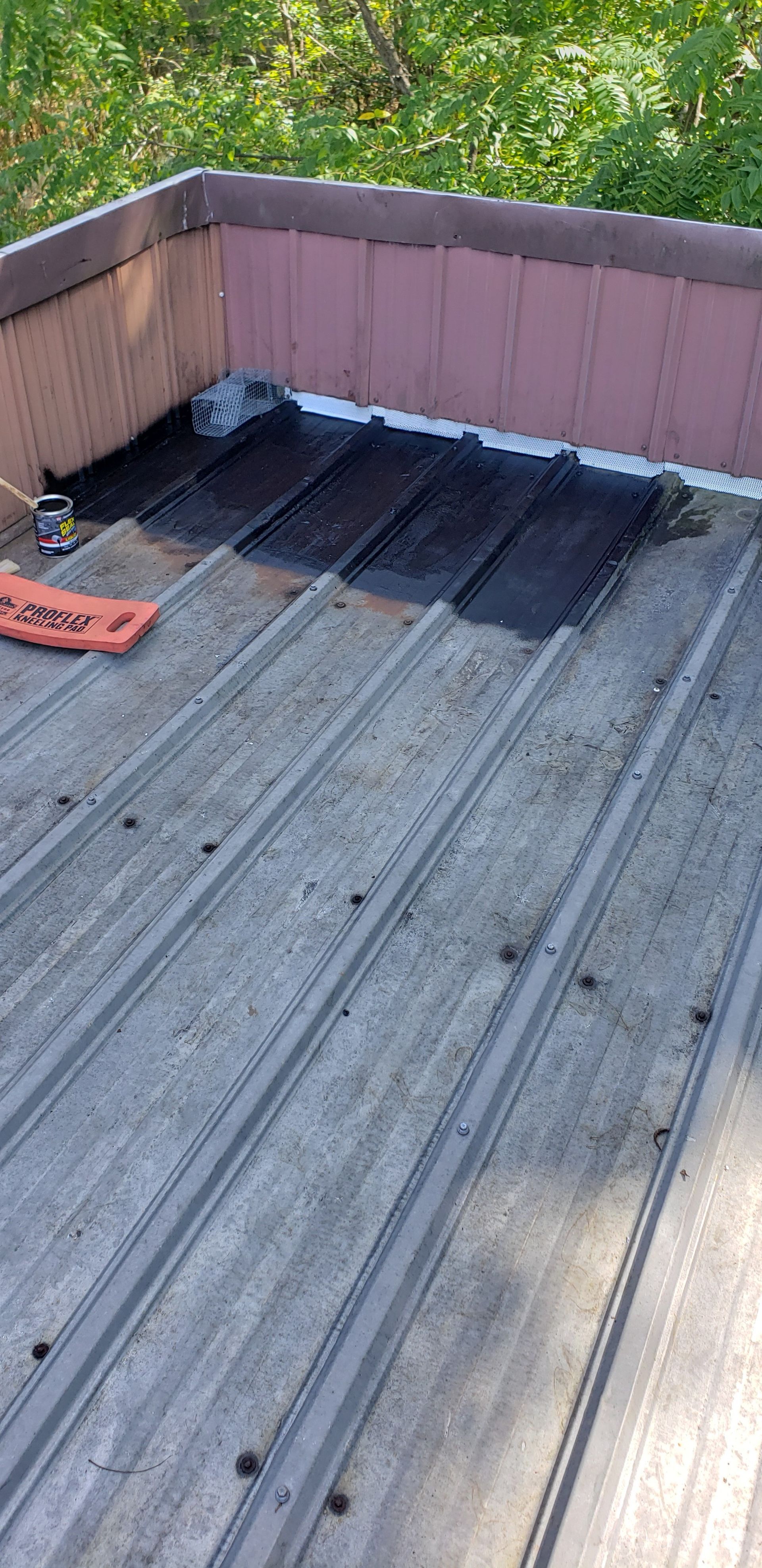 A metal roof is being installed on a balcony.