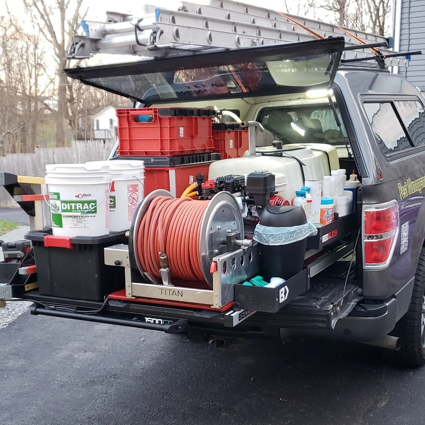 A truck with a bunch of tools in the back of it