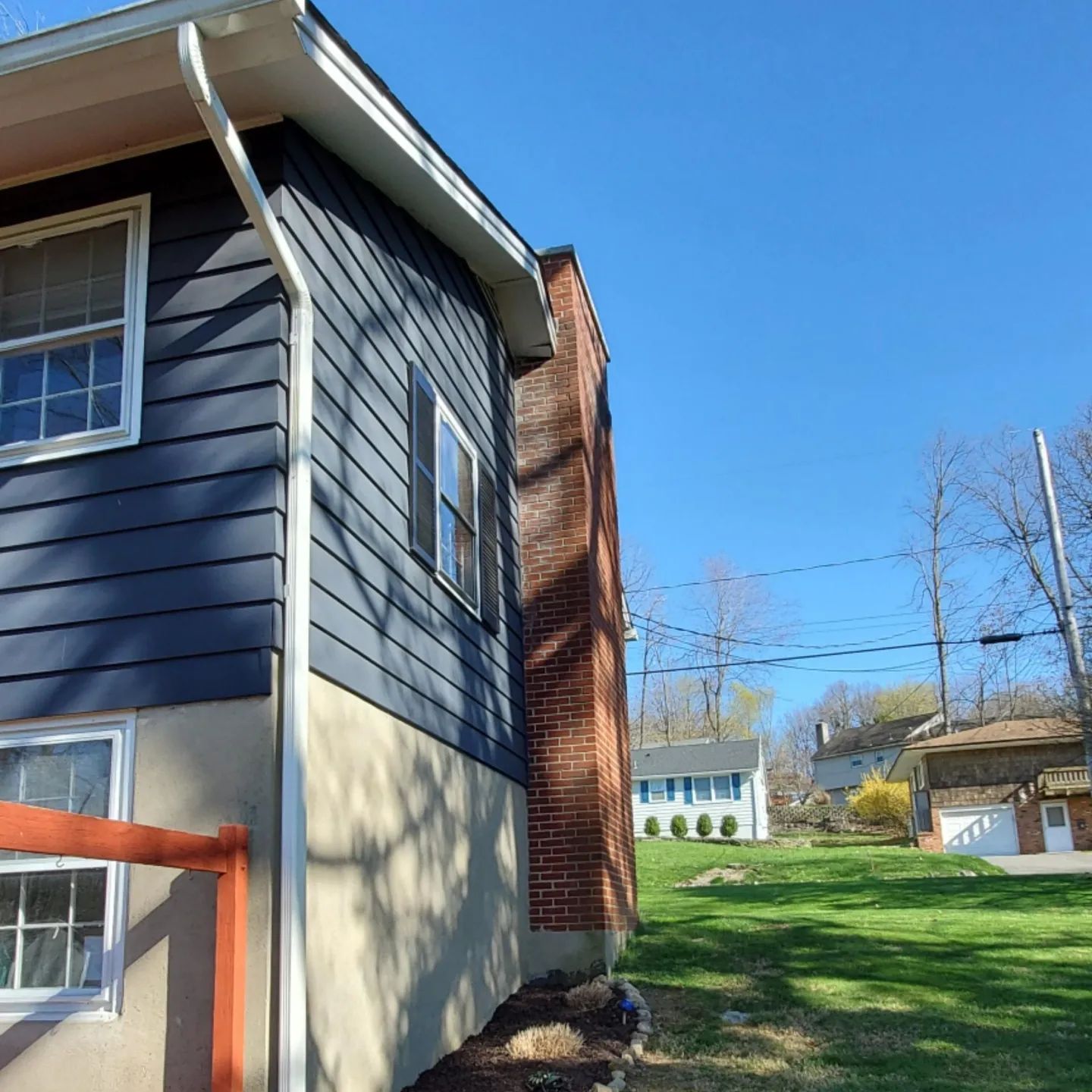 A house with a chimney on the side of it