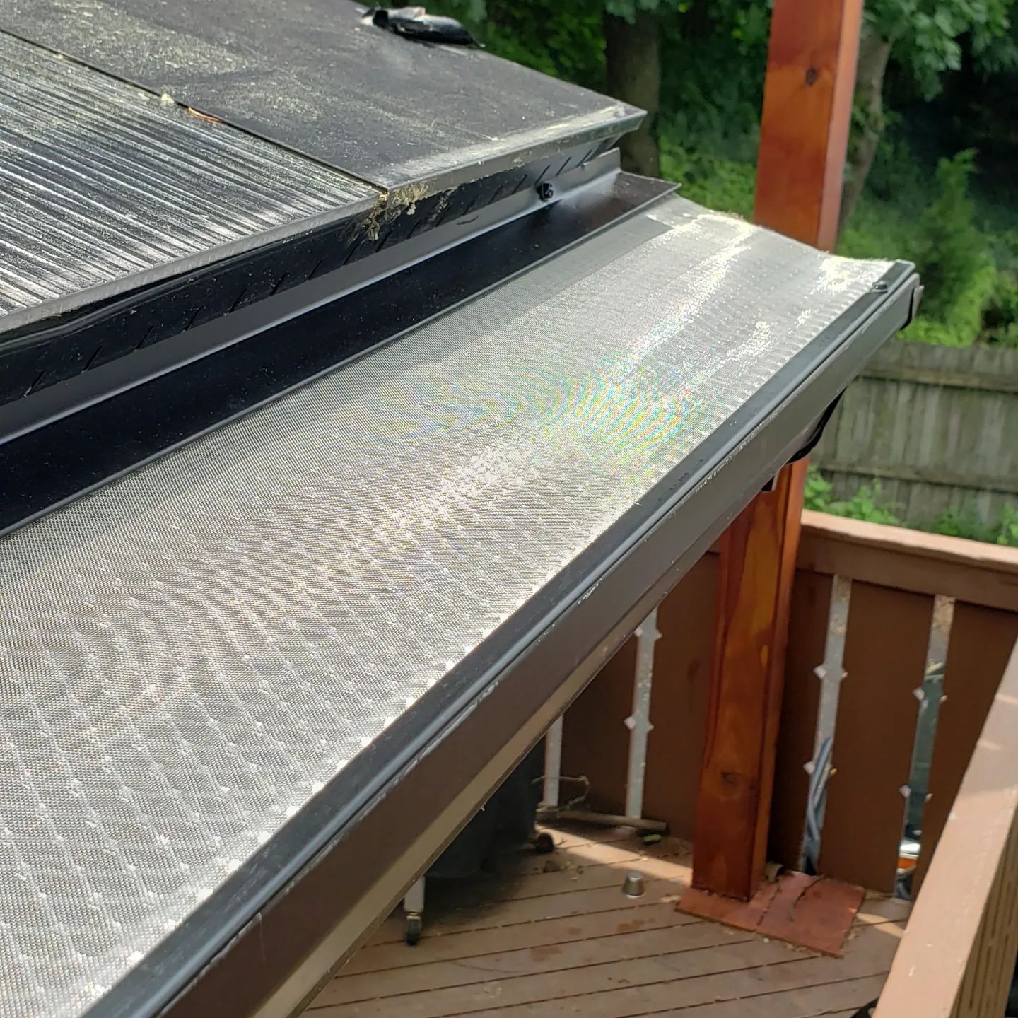 A close up of a roof with a gutter on it