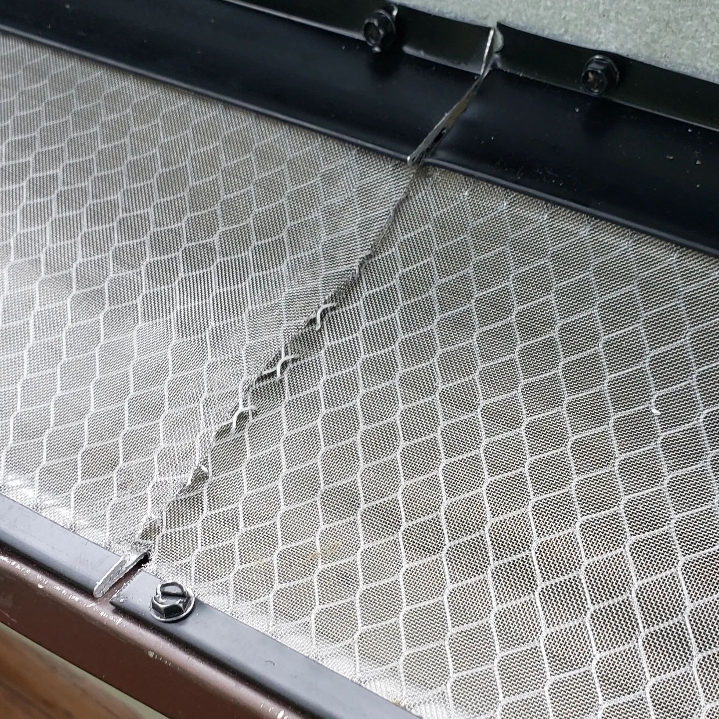 A close up of a metal surface with a pattern on it.